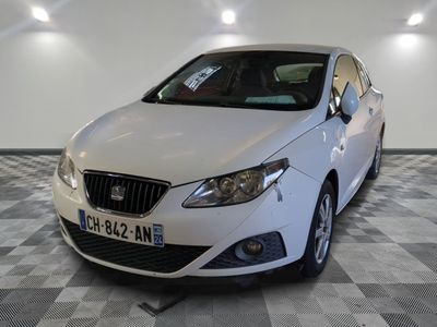 a picture of a white car on a checkered floor
