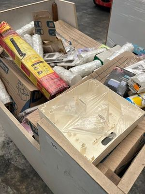 a box full of assorted items sitting on the floor