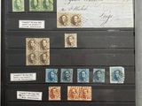 a picture of a collection of stamps on a black board
