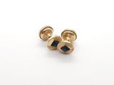 une paire de boutons de manchette en or sertis de pierres noires