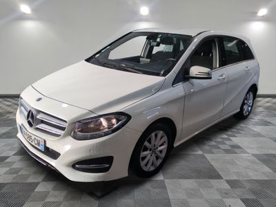 the mercedes b - class is parked on a checkered tile floor