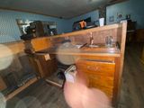 a blurry image of a person standing in a kitchen