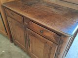 a wooden cabinet with a wooden top and drawers