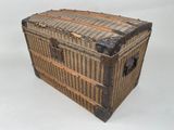 an old trunk that is sitting on a white surface