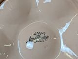 a white plate that has a picture of a bird on it