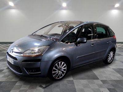 a picture of a silver citrole parked in a garage