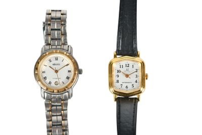 an image of a couple of watches sitting next to each other