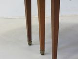 an image of a wooden table with wheels on it