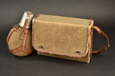 a brown bag and a tan bag with a lighter in it