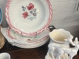 a lot of plates and cups on the table