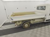 a white truck that is parked in a garage