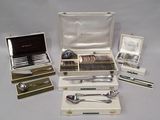 a lot of silverware in a case on a table