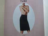 an image of a magazine with a picture of a woman in a black dress