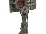 a small metal camera on a tripod on a white background