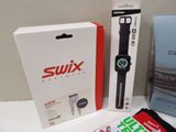a box with a watch on it next to a pair of men ' s socks