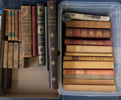 many old books in a box on the floor