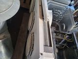 an old oven sitting in the corner of a room