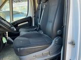 a white van with black seats in the back of it