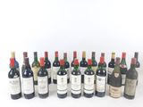 several bottles of wine are lined up in a row on a white surface