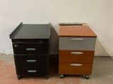 two filing cabinets sitting next to each other on the floor