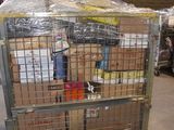 a large metal cage filled with boxes in a warehouse