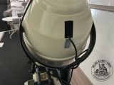 a motorcycle that is sitting in a room with a light on it