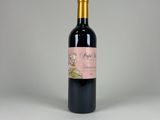 a bottle of wine that is sitting on a table