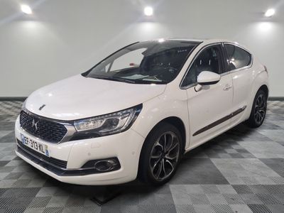 the white car is parked on a checkered floor in a room