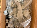a cardboard box filled with assorted electronic components