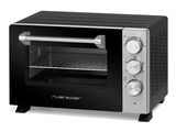 un four grille-pain noir et argent posé sur un plan de travail blanc