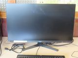 an image of a computer monitor and keyboard on a desk