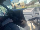a view of the inside of a car from the driver ' s seat