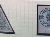 two stamps on the wall of a bathroom with a toilet