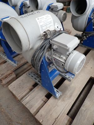 two blow pumps sitting on a pallet in a warehouse