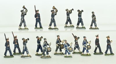 many figurines of men in uniform on a white surface