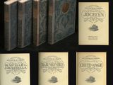six livres sont alignés sur une surface noire