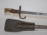 a knife and a sword on display on a table