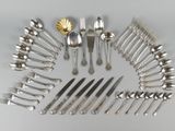 many different types of silverware arranged in a circle