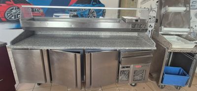a kitchen with stainless steel appliances and a counter top