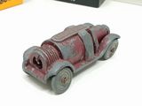 a small toy car that is sitting on a table