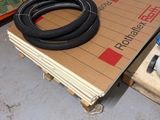 a pile of boxes and a hose on the floor