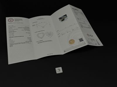 un dé blanc posé sur une table, à côté d'un livre