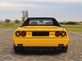 a yellow sports car parked in a parking lot