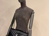 saint laurent handbags on display in a store window