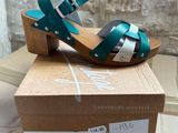 the box is open and has a pair of shoes on top of it
