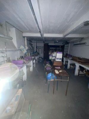 an image of a room with a lot of tables and chairs