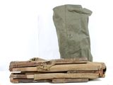 a pile of wood and a bag on a table