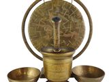 an antique brass mortar set with four bowls and a wooden stand