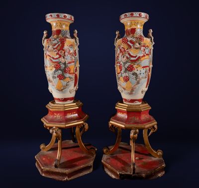 pair of antique vases on stands with red and gold decoration