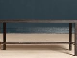 the table is made of wood and has a metal frame
